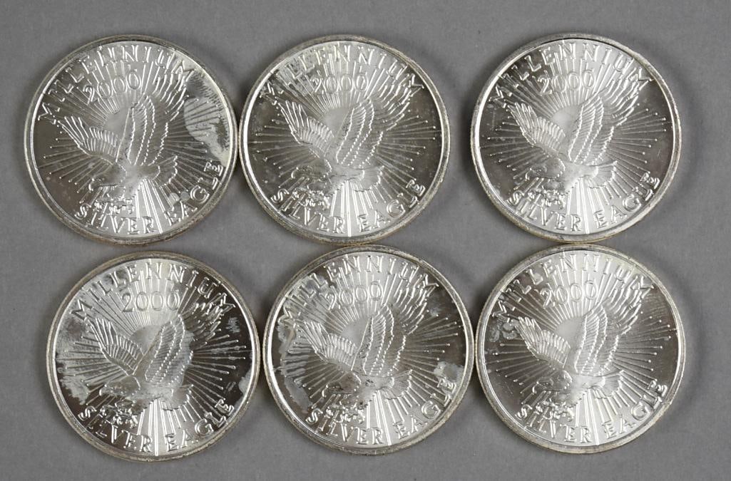 6 Fine Silver Eagle Coins 6 ozT .999: They are 2000 Millennium, 1 troy ounce each for a total of six troy ounces.
