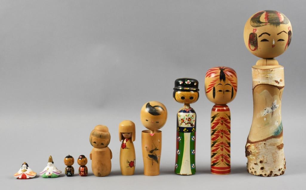 (10) Vintage Japanese Kokeshi Doll Assortment: Lot is for 10 adorable vintage Japanese Kokeshi dolls. Eight are wood, two appear to be painted bisque fortune dolls with their original labels on bottom. They stand approx. 1.5" to 14" tall.
