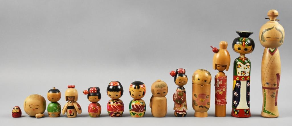 (12) Vintage Japanese Kokeshi Doll Assortment: This lot is for 12 adorable vintage Kokeshi dolls from Japan. A few are marked on bottom and one retains original paper label. They are hand painted and stand from approx. 1" tall to 11" tall with no