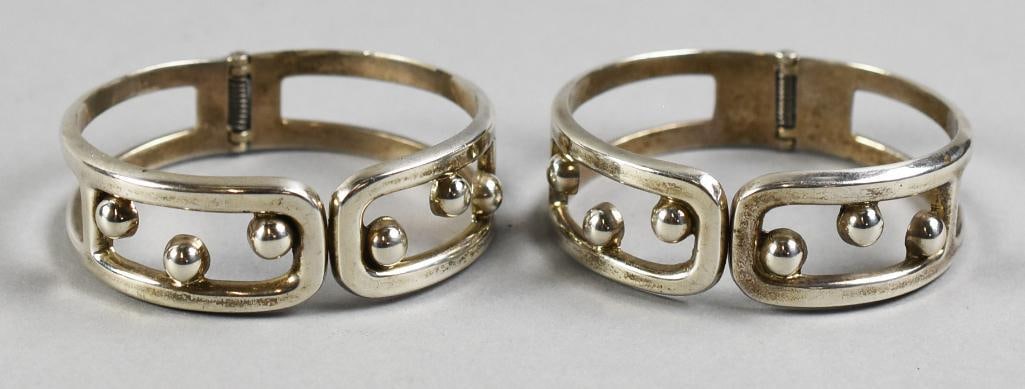 Vintage Modernist Sterling Silver Bangle Bracelets: These are a wonderful pair of vintage sterling bracelets. These modernist pieces and hinged bangles with suspended ball accents. Stamped inside 925 and weigh approx. 2.6 troy ounces.