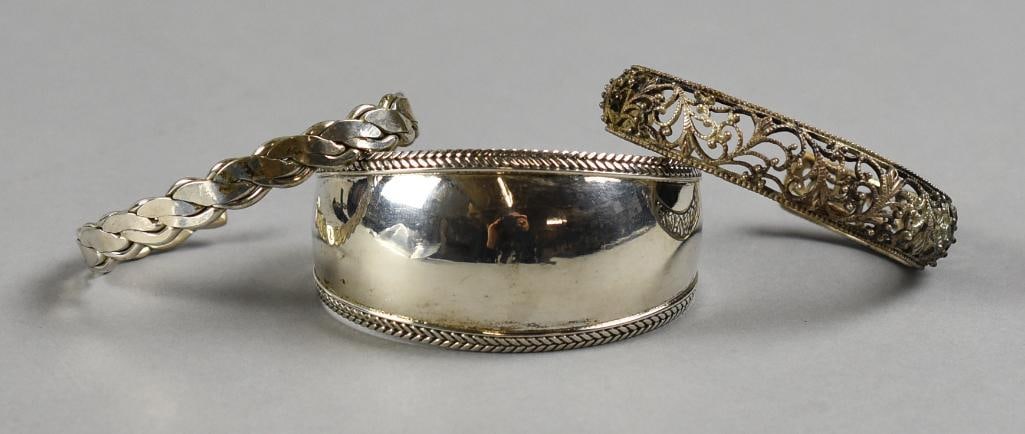 Vintage & Contemporary Sterling Silver Bracelets: These are lovely vintage and contemporary sterling silver bracelets. All are cuff style, one solid wide band stamped 925, one narrow braided band and one filigree scroll work. Bracelet appears to be