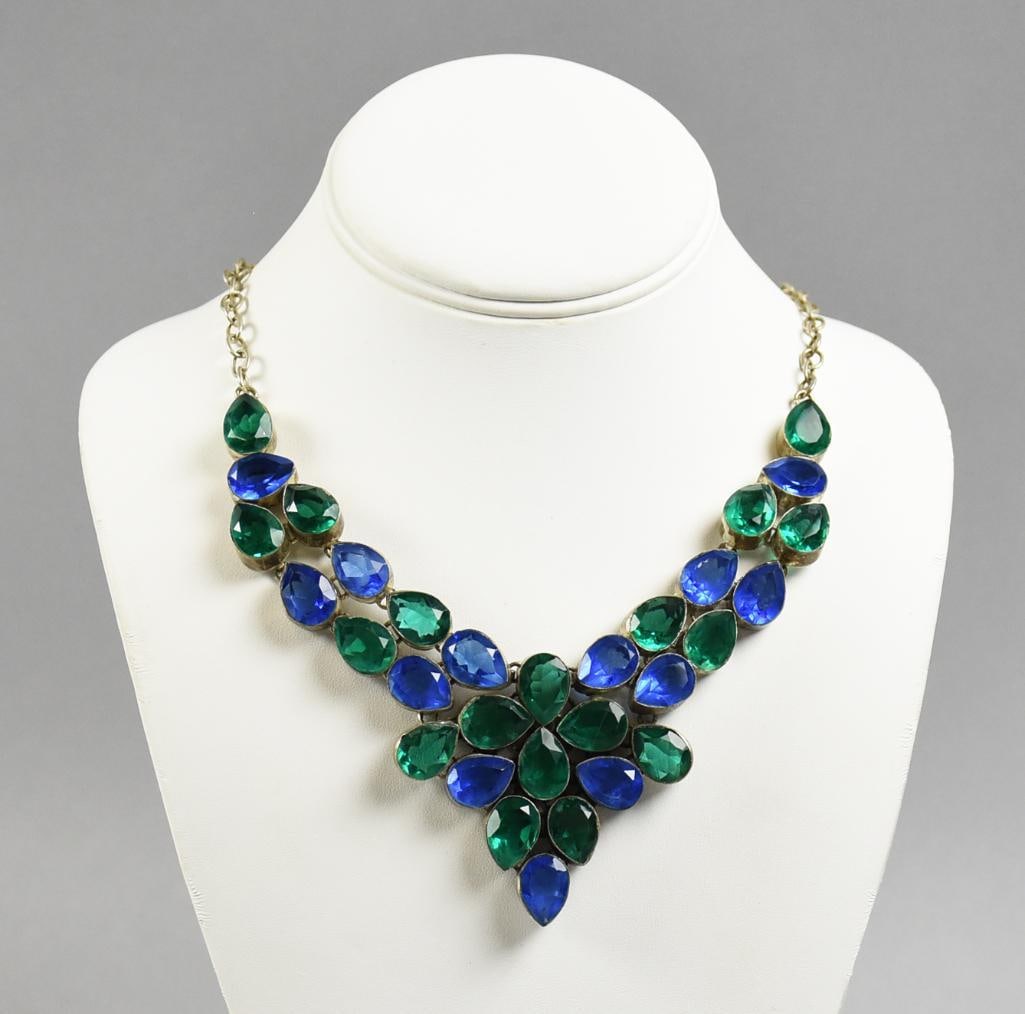 Designer Silver, Blue and Green Crystal Statement Necklace: Beautiful necklace in a bib designer style. Silver tone chain with teardrop cut crystals in green and blue. Measures approx. 18" long.