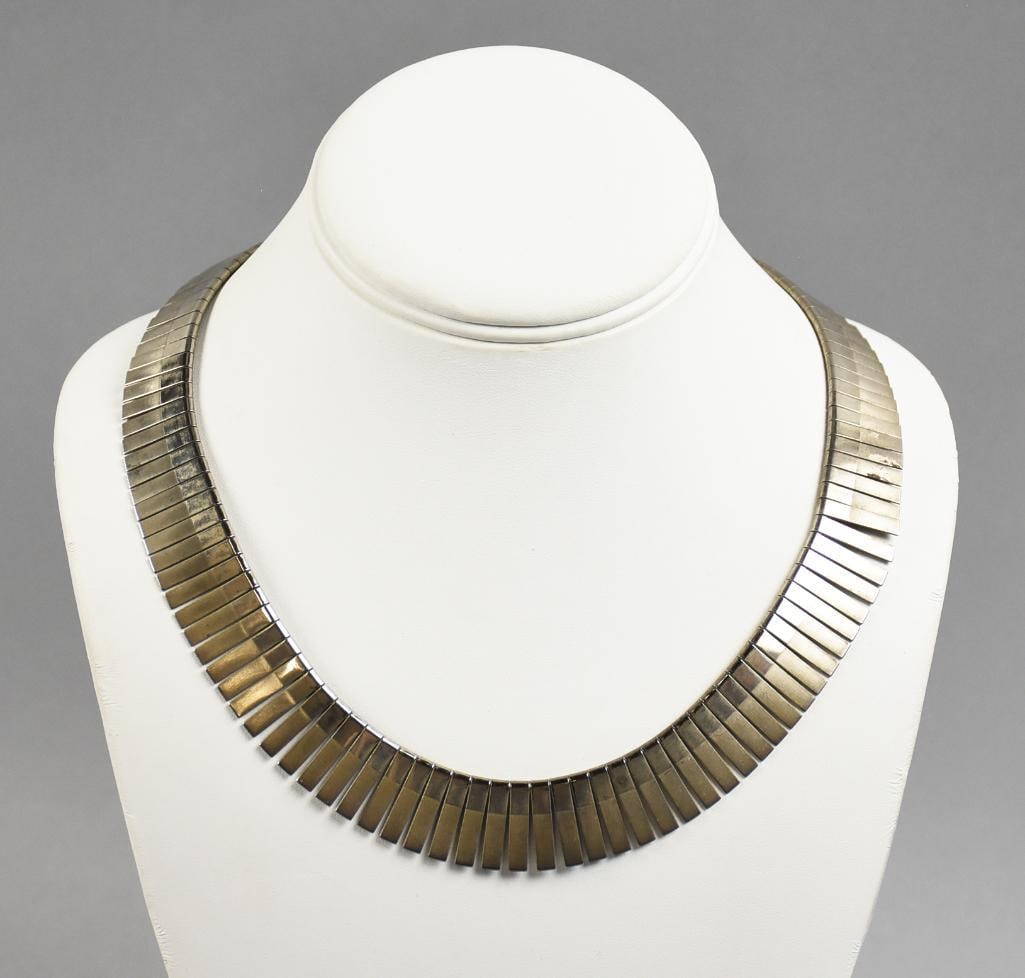 Bib Style Necklace: A nice, vintage, silver colored bib style necklace. It measures 34"long.