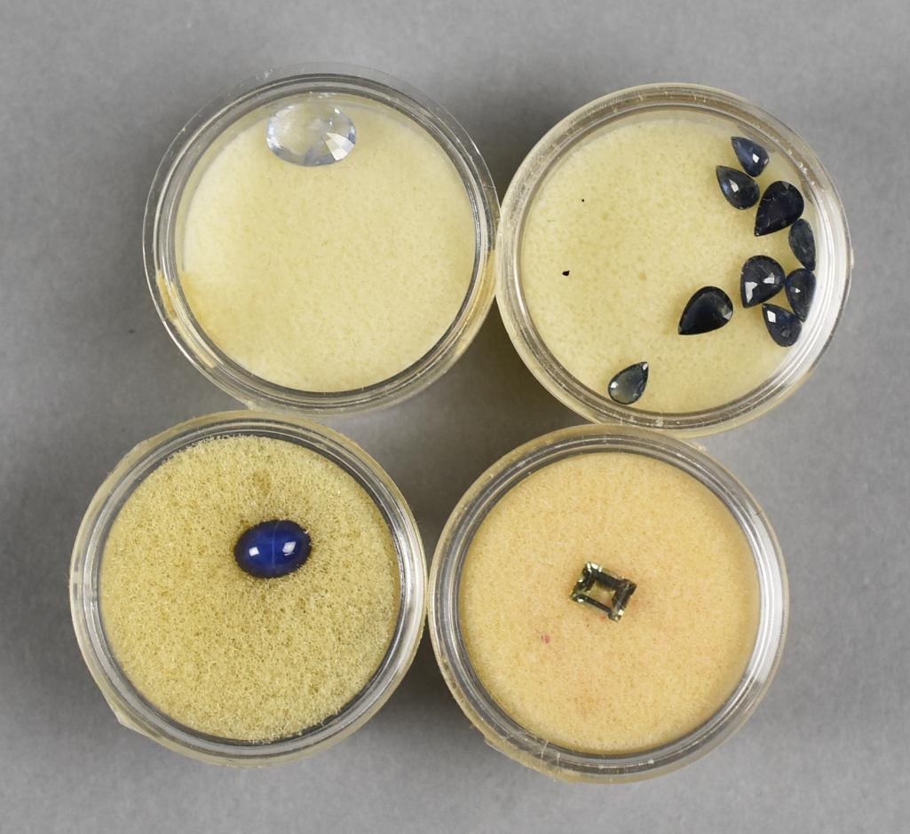 Natural Sapphires, Assort Colors: Pretty assorted loose sapphires in various shapes and sizes, most are deep blue with one being very pale green and one very pale blue.