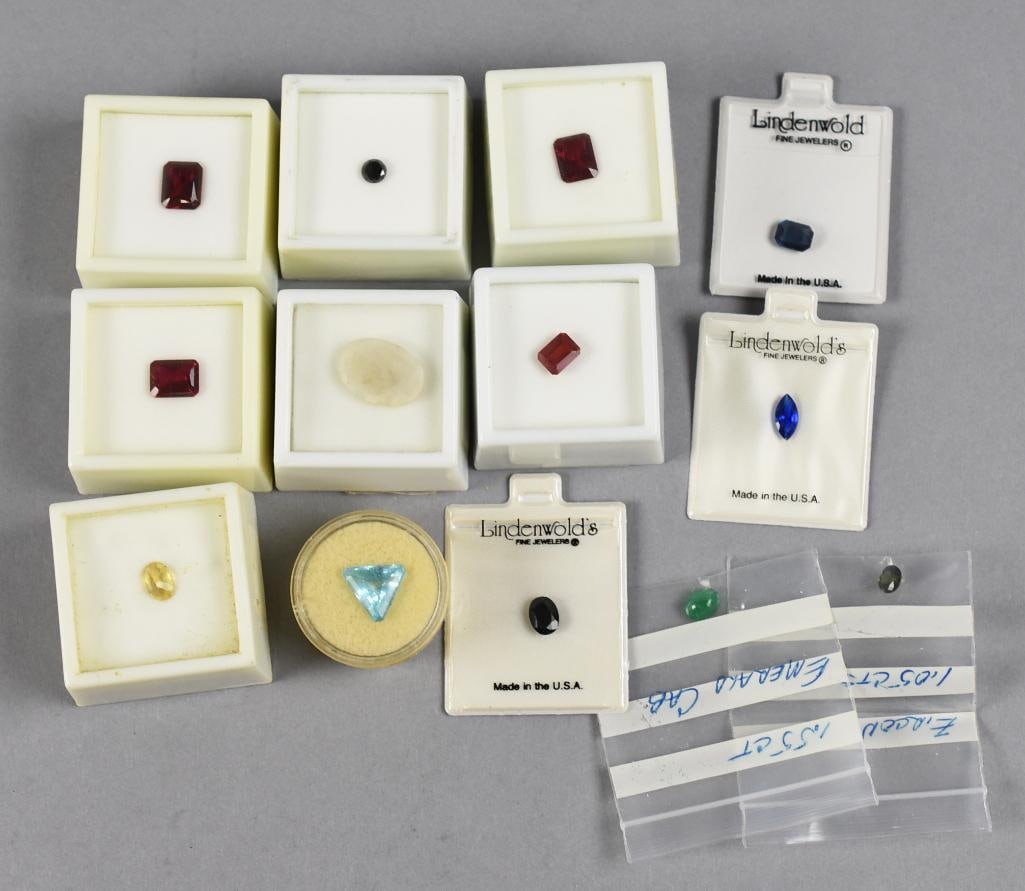 Various Assorted Loose Gemstones: This lot contains an emerald cabochon, black diamond, lab created rubies and more. All will come as shown.