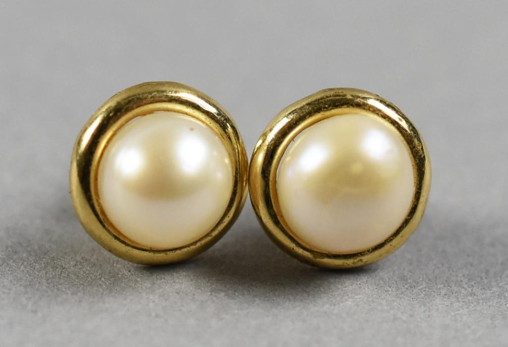 14K Frederick Goldman Pearl Pierced Earrings: This wonderful pair of 14K earrings is believed to be Frederick Goldman (founded in 1948). Large round pearl with nice luster set in 14K yellow gold. The backs of the earrings are marked 14K FG and