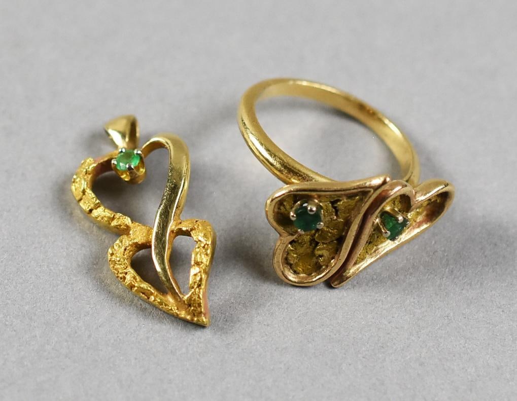 Vintage 10K and 14K Emerald Stylized Heart Jewelry: These pretty pieces are both stylized hearts in gold. The double heart pendant with single round cut emerald is marked 10K and is approx. 1.8 grams. The double heart ring with round cut emeralds is 14