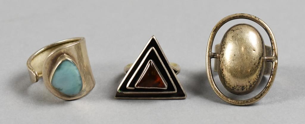 Taxco Sterling Silver Ring Vintage Assortment: Lot is three sterling rings, all appear to be Taxco sterling. Includes an oval ring, modernist pyramid shape and amazonite that is adjustable. All are approx. size 9.