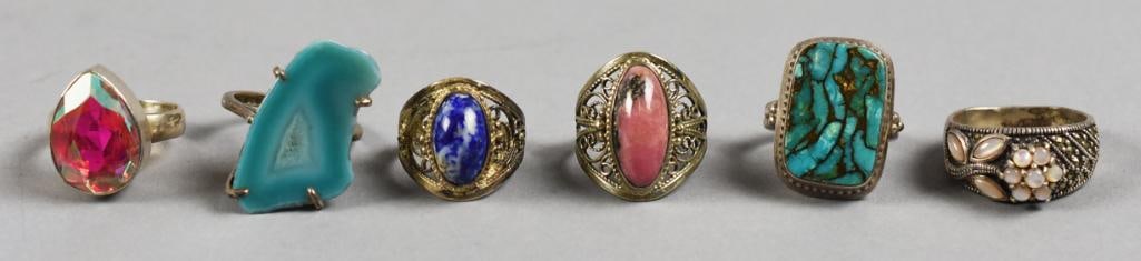 Sterling & Semi Precious Stone Ring Assortment Vintage: Pretty collection of sterling rings with semi precoius stones. Stones appear to be turquoise, rhodonite, sodalite and more. Sizes are approx. Some appear to be signed. 7.5 to 10.