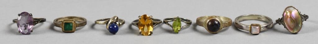 Sterling Ring Lot with Semi Precious Stones: Beautiful assortment of sterling silver rings, all with various stones. Stones include lapis, moonstone, abalone and more. They are all size approx. 5.5 to 11. They're either stamped 925 and sterling.