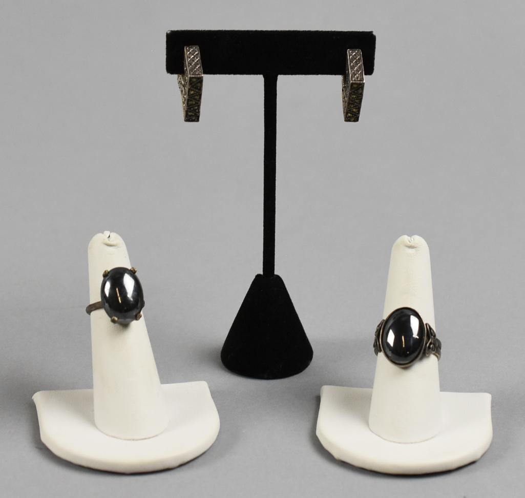 Sterling, Marcasite and Hematite Jewelry: Pretty lot of vintage sterling. Lot includes a pair of marcasite square hoop style pierced earrings and two hematite rings, one with marcasite accents. Each is marked.?