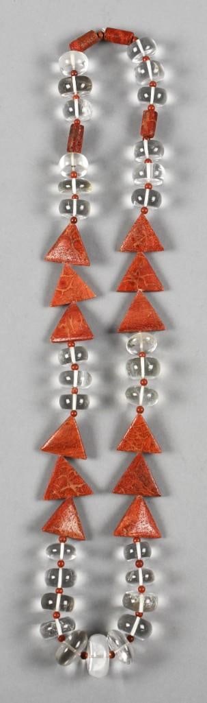 Coral & White Topaz Fashion Necklace Vintage: Beautiful necklace with triangular cut coral beads with beautiful clear white Topaz disc beads. Measures approx. 28" long.