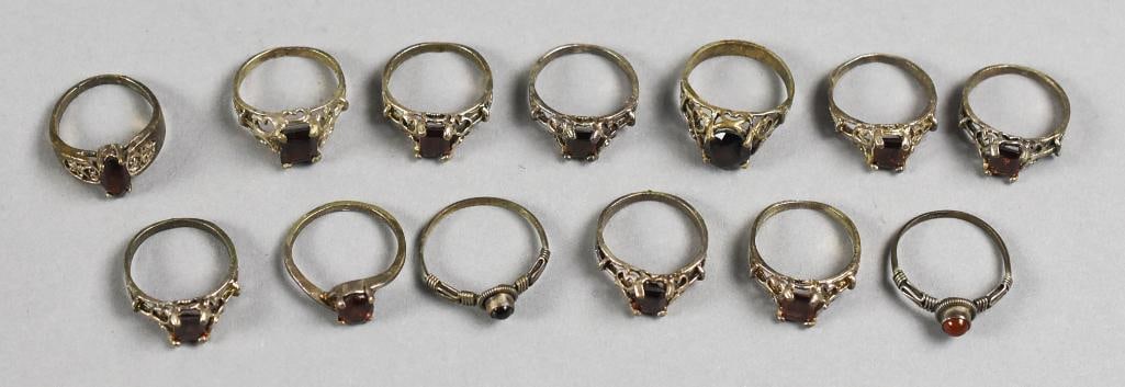 Sterling & Garnet Ring Collection Vintage: This is a wonderful collection of sterling rings, all are set with garnets. Most of the stones are faceted, two are cabochon. Lot with duplicates.