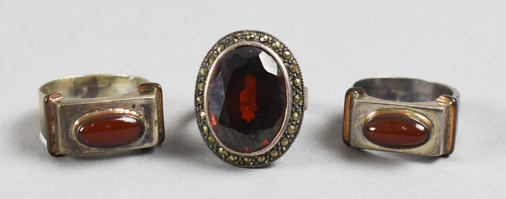 Sterling Silver & Garnet Ring Assortment Vintage: Beautiful sterling rings, each set with what appears to be garnets. Two with cabochon and one faceted with marcasite accents. All are approx. size 9.?