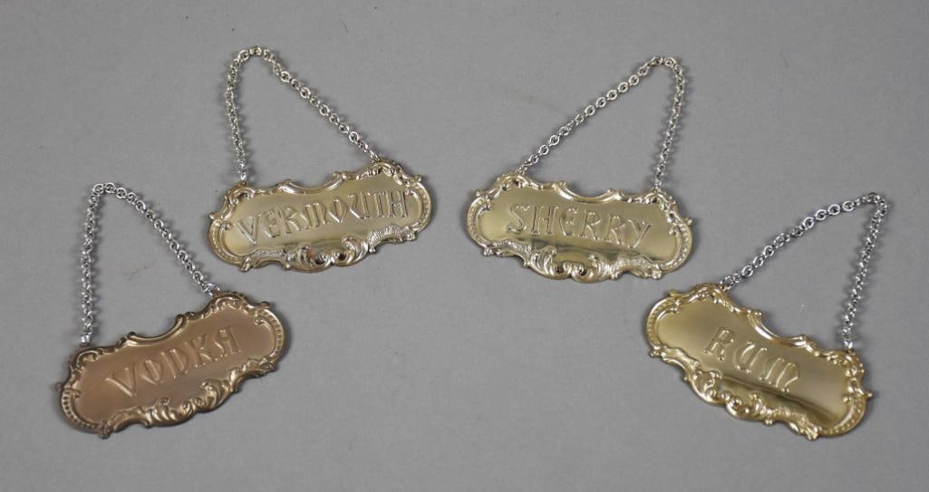 Gorham Sterling Silver Liquor Bottle Tags: Great looking Gorham sterling silver liquor bottle tags. Includes vermouth, rum, vodka and sherry. Tags are sterling, the chains are rhodium plated brass. Each tag is approx. 3" wide. Overall weight i
