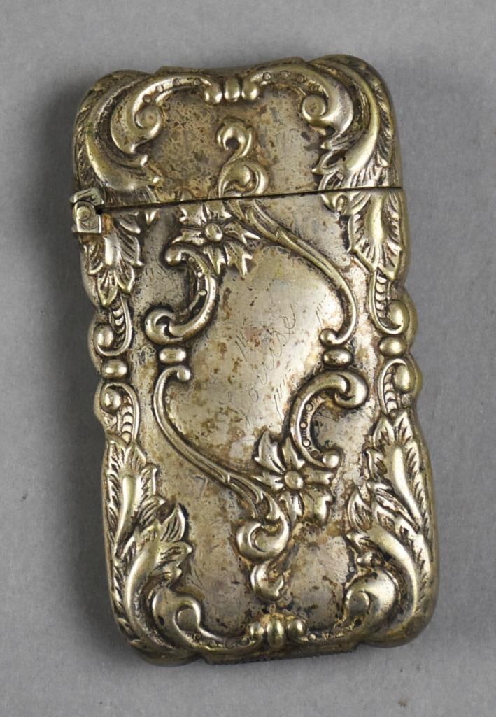 G. Silver Victorian Vesta Case: Victorian silver Vesta Case w Dedication. Wonderful Victorian silver vesta case. It has beautiful scroll and flower details in low relief. One side is in cursive Louise, the back is cursive H. G.