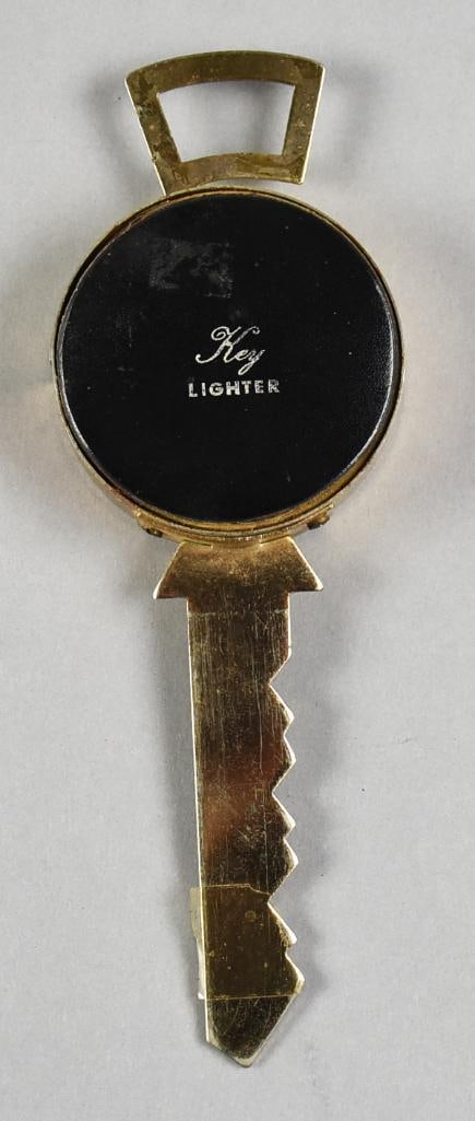 Vintage Japanese Key Petrol Lighter: Very cool lighter from Japan. Novelty in the form of a key, it is a petrol lighter and measures approx. 7" long. Press down the lever and the lighter opens up on the side.