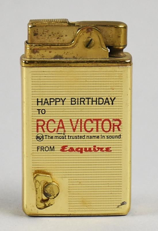 RARE Vintage RCA Victor Birthday Supreme Musical Lighter: This very cool lighter is vintage from Japan. It is a Supreme Musical Lighter, wind up to play music. This was a dedication to wish RCA Victor Happy Birthday from Esquire. Gold tone, textured. Back of