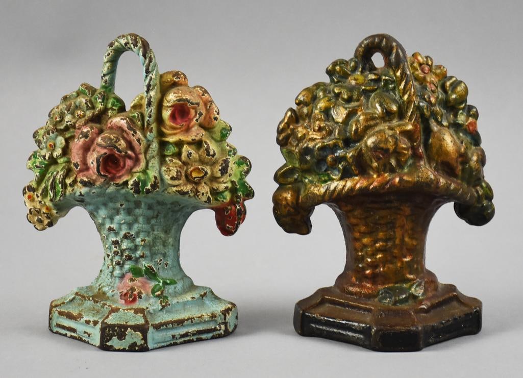 Pair c1925 Hubley Flower Basket Cast Iron Door Stop: Lot is for a pair of really pretty door stops from Hubley. Each is in the form of a basket, each filled with flowers. One with pastel colors and one with darker colors. One with impressed 8, one with