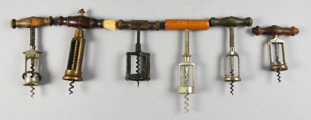 Vintage & Antique Bearing & Spring Assisted Corkscrews: This lot is for a cool collection of vintage and antique bearing assisted and spring assisted corkscrews. All with wooden handles, one with dusting brush. They are all approx. 5" to 7" long.