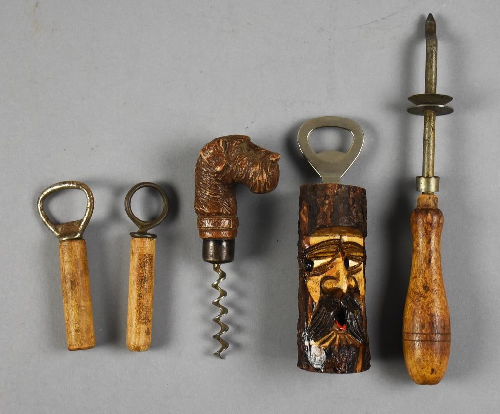 Vintage & Antique Bottle Openers and Corkscrews: Interesting and fun lot of various bottle openers and corkscrews. Includes two clough corkscrews, dog profile corkscrew, carved face bottle opener and an adjusting blade can opener. All measure from a