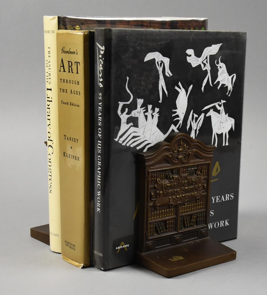 Antique Bradley & Hubbard My Library Bookends: Beautiful pair of bookends from Bradley and Hubbard. They are each a bookshelf filled with books with the quote "My Library Was Dukedom Large Enough" from Shakespeare. Nicely marked on back and measur