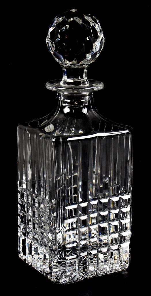 Tiffany & Co "Plaid" Cut Crystal Decanter: This beautiful decanter is from Tiffany & Co. It is the pattern Plaid, square base with square pattern, original stopper and retains original label as well as acid mark on base. Measures approx. 10" t