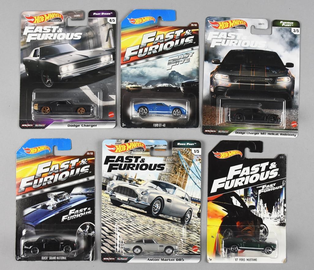 (6) 2000s Hot Wheels Fast & Furious - MOC NOS: Lot is for six Mattel Hot Wheels from the 2000s and includes: Buick Grand National, Dodge Charger, Ford GT 40, Aston Martin DB5, '67 Ford Mustang and Dodge Charger SRT Hellcat Widebody.
