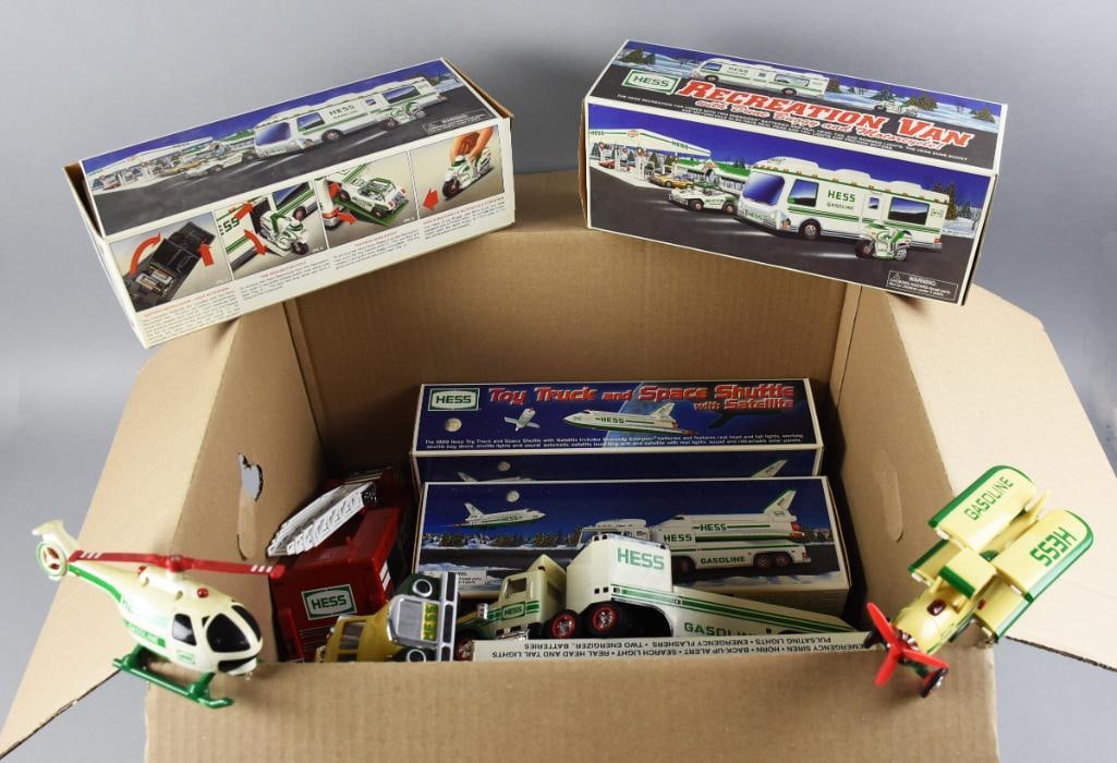(13) Hess Battery Operated Toy Trucks & More Loose & MIB NOS: Great lot of various Hess toy trucks. Some are mint in the box and battery operated. Includes Recreation Van, Toy Truck with Space Shuttle and more. Some are loose, lot with duplicates.