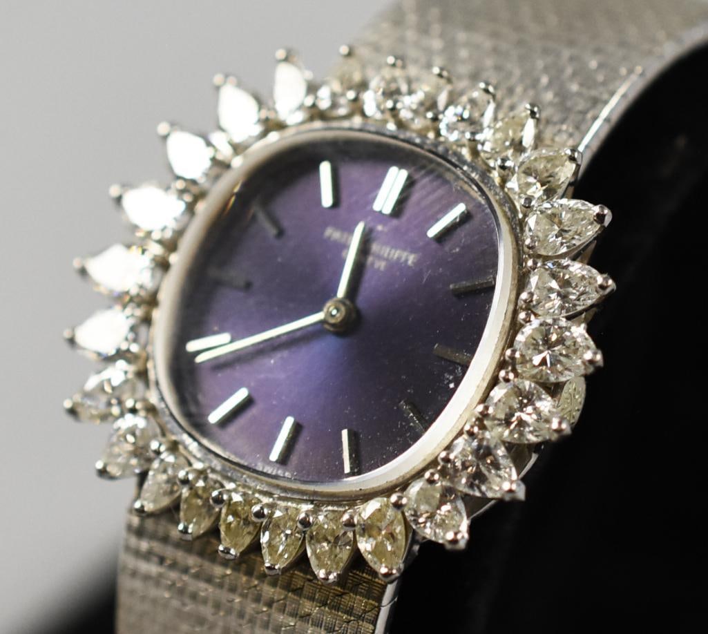 Patek Philippe 18K White Gold Diamonds Watch Vintage: This is a stunning WORKING vintage Patek Philippe ladies watch in 18K white gold. Subtle elliptical case surrounded by teardrop diamonds. Blue face and original mesh band. Back of case stamped 18K, ba