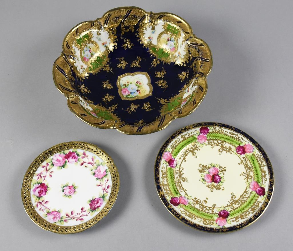 c1900 Nippon Porcelain Plates and Bowl: These spectacular pieces are antique Nippon porcelain. One smaller plate measures approx. 6" across with with pink and magenta roses and gold and black laurel trim. Larger plate measures approx. 8" ac