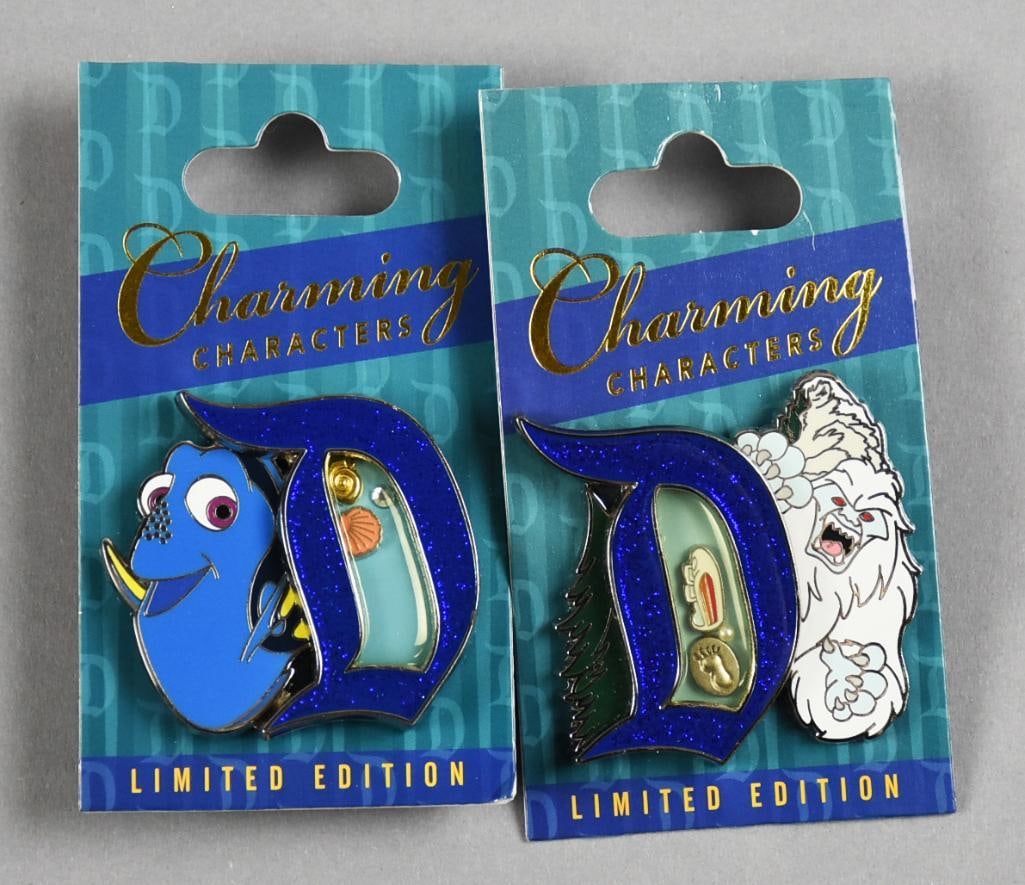 Ltd Ed Disney Charming Characters Lapel Trade Pins: These are cool lapel trade pins from Disney. They each are Charming Characters, Dory from Finding Nemo and Yeti from Monsters. Two pins on each card with the D having charms. Come on their original ca