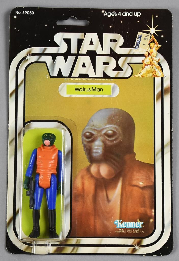 1978 Kenner Star Wars Walrus Man 21B Card Back MOC NOS: Lot is a Star Wars Walrus Man action figure from Kenner in 1978. It is on a 21B card back and is stored in a clear plastic protective case. Retains the original purchase price sticker.