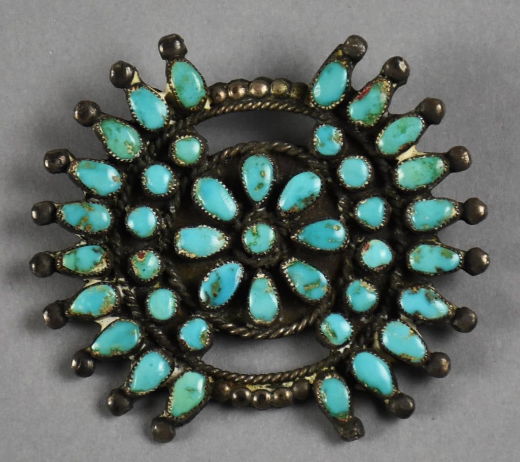 Vintage Zuni 800 Silver and Turquoise Brooch: Stunning vintage brooch is Native American, Zuni. Sun rays brooch with center flower all in turquoise. No visible marks, tests as 800 silver. Measures approx. 2.5" wide.