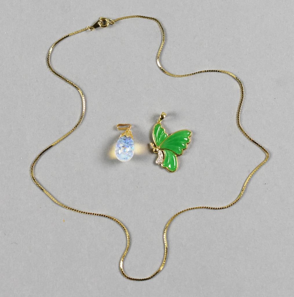 14K Gold Opal and Jade w/ Diamond Pendants: Wonderful 14k yellow gold pendants with one appearing to be an opal in a teardrop shape, marked on bale. The butterfly appears jade with diamonds, stamped on bale 14K and 585. Includes the long gold