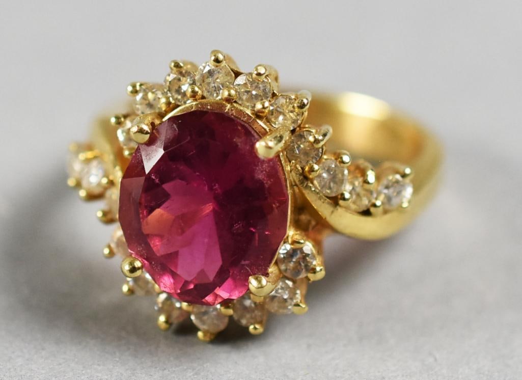 14K Yellow Gold, Tourmaline and Diamond Ring: Lovely ring in 14K yellow gold. It is set with a pretty oval cut tourmaline. accented with round cut diamonds that trail down the side of the band. It is stamped 14K with no other visible marks. Size 