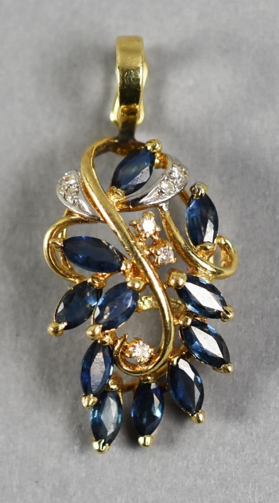 14K Yellow and White Gold, Sapphire and Diamond Pendant: Gorgeous pendant with ball lock bale. It is 14K yellow gold with 11 navette cut sapphires and diamond accents. Some of the diamonds are set in white gold. It is stamped inside the locking bale 14K