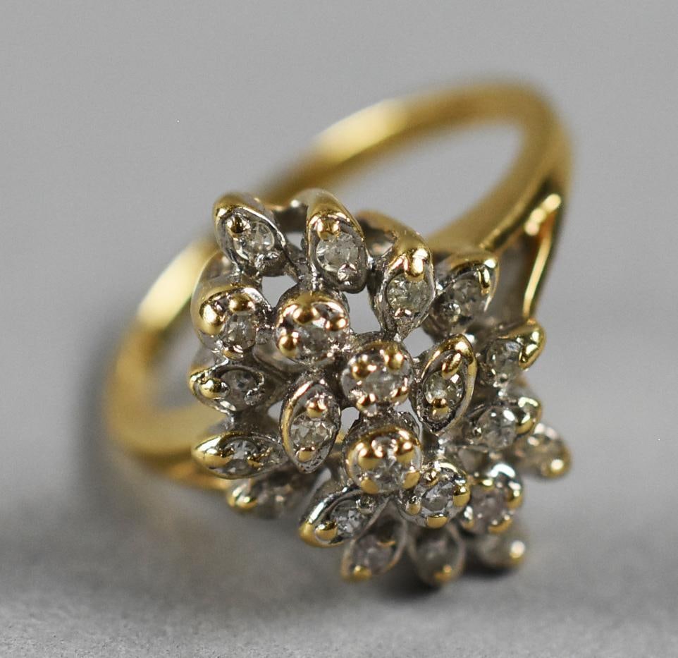 Vintage 14K Yellow Gold Diamond Cocktail Ring: Gorgeous vintage 14k yellow gold cocktail ring. Round cut diamond encrusted what appears to be two prong leaf shaped settings and round four prong settings. It is stamped inside the band 14K, an