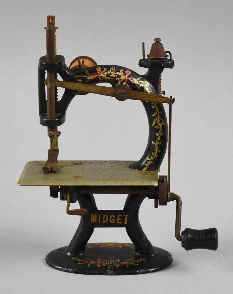 c1900 Foley & Williams Midget Child's Sewing Machine: This is an adorable antique child's sewing machine from Foley & Williams Mfg. This c1900 Midget is hand painted iron with flowers and vines. Plate and moving parts appear steel with hand crank having