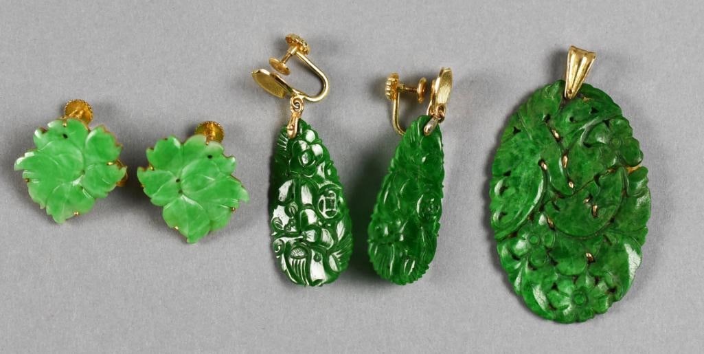14k Gold Imperial Jade (?) Jewelry: This fabulous lot is jade with 14K gold. Beautiful Imperial green jade pendant, pierced with carved flowers and 14K gold support on back that peeks through. Two pair of screw back earrings, one pair a