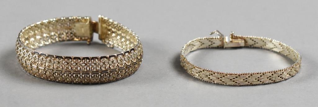 Vintage Italian Sterling Bracelets: Lot is for a pair of lovely sterling silver bracelets, both made in Italy. The wider bracelet with interwoven S scrolls, the other is a chevron mesh style. Stamped, with no visible designer marks. Eac