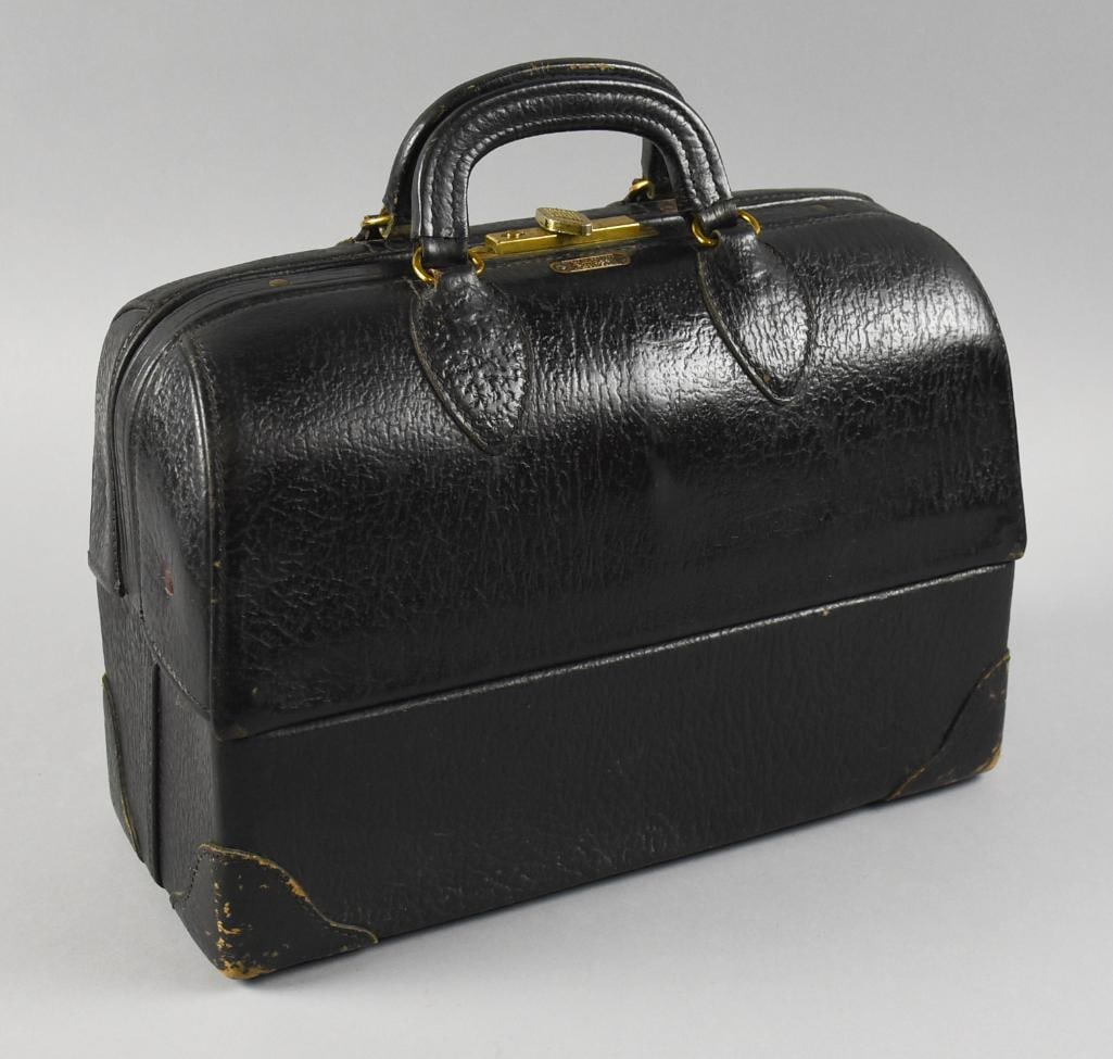 c1940 Emdee by Schell Leather Doctor Bag: This wonderful piece is a c1940 Emdee doctor's bag by Schell. Pebbled cowhide leather with brass hardware. Inside the top double flap lid with concealed compartments, inside with spaces for tools. It