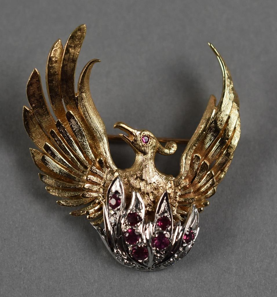 Mobil 14K Gold Ruby Dia Phoenix Brooch: Fabulous vintage brooch in both 14K white and yellow gold. Phoenix bird with yellow gold wings, body in white gold set with rubies with a random diamond accent. Designer stamp, unidentified and stampe