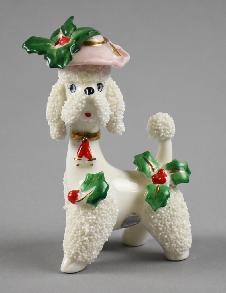 c1955 Napco Christmas Spaghetti Poodle: Precious Napco Christmas poodle. Poodle with spaghetti coat, cute pink hat and adorned with holly and berry. Retains the original silver foil label?and is ink stamped on bottom. Measures approx. 5" ta