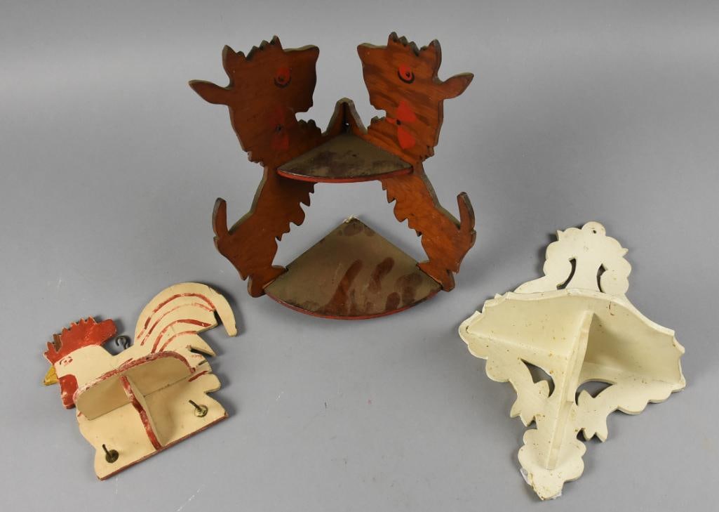 Vintage Folk Art Wall Shelves: Lot is for some very cute vintage folk art shelves. You will get the little scottie dog corner shelf with hand painted eyes and bow tie, hand painted rooster with hooks and white painted pierced wood.