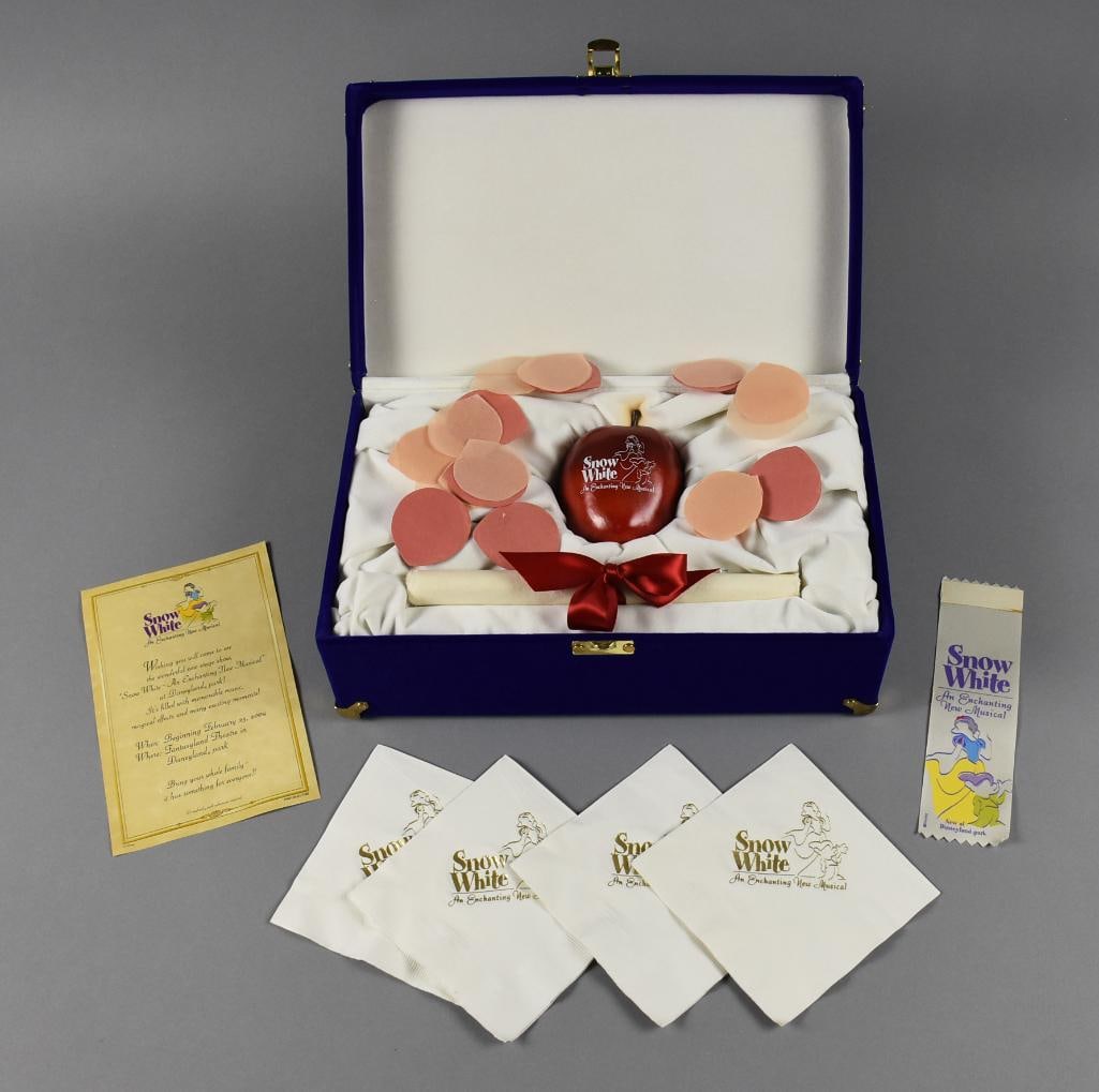 2004 Disneyland Snow White Musical VIP Souvenir Set: Awesome souvenir set from Disneyland for Snow White An Enchanted New Musical that ran from 2004-2006. Gift box contains a replica apple in wood with graphics for the musical and a rolled invitation. C