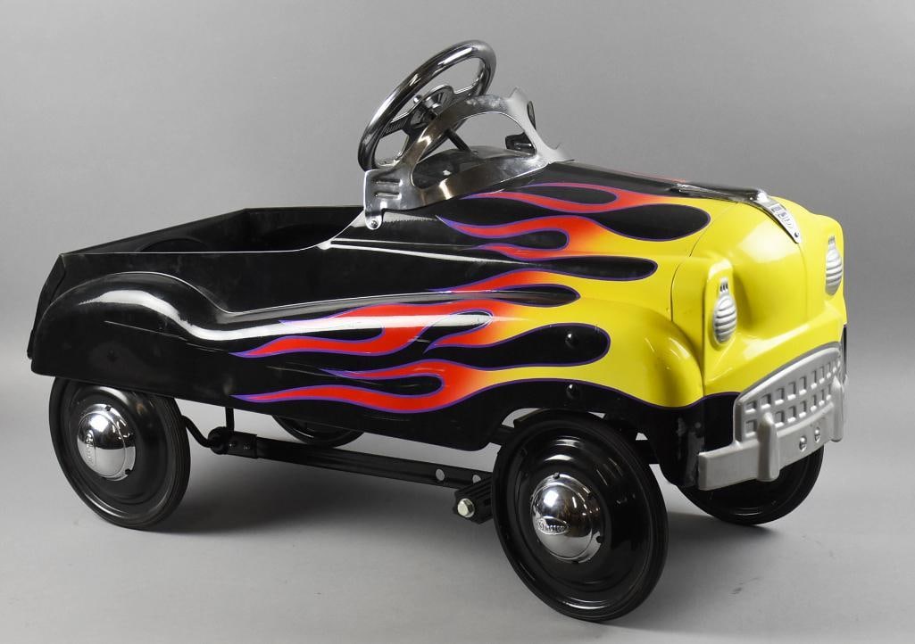 2003 Instep Flame Hot Rod Pedal Car: Awesome reproduction pedal car from Instep from 2003. Black hot rod with red and yellow flames outlined in purple. Retains the original label inside the body. Measures approx. 22" x 34" x 15". Single