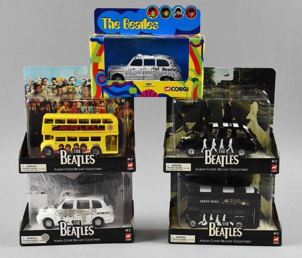 (7) Corgi Beatles Diecast Album Cover Plus Diecast MIP NOS: Fun lot of five Corgi Beatles Album Cover collection. Covers are Sgt Pepper, Revolver and two Abbey Road, one car, one double decker bus. Also includes a Yellow Submarine Newspaper Taxi. Single owner