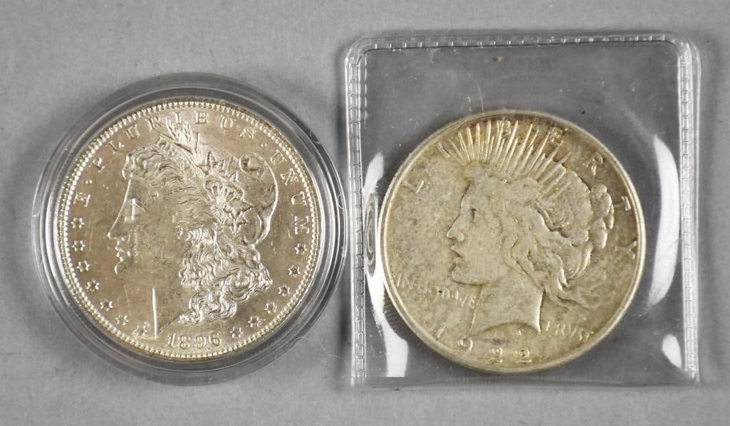 1896 Morgan and 1922 Peace Dollar: Lot is an 1896 Morgan silver dollar and a 1922 Peace silver dollar.