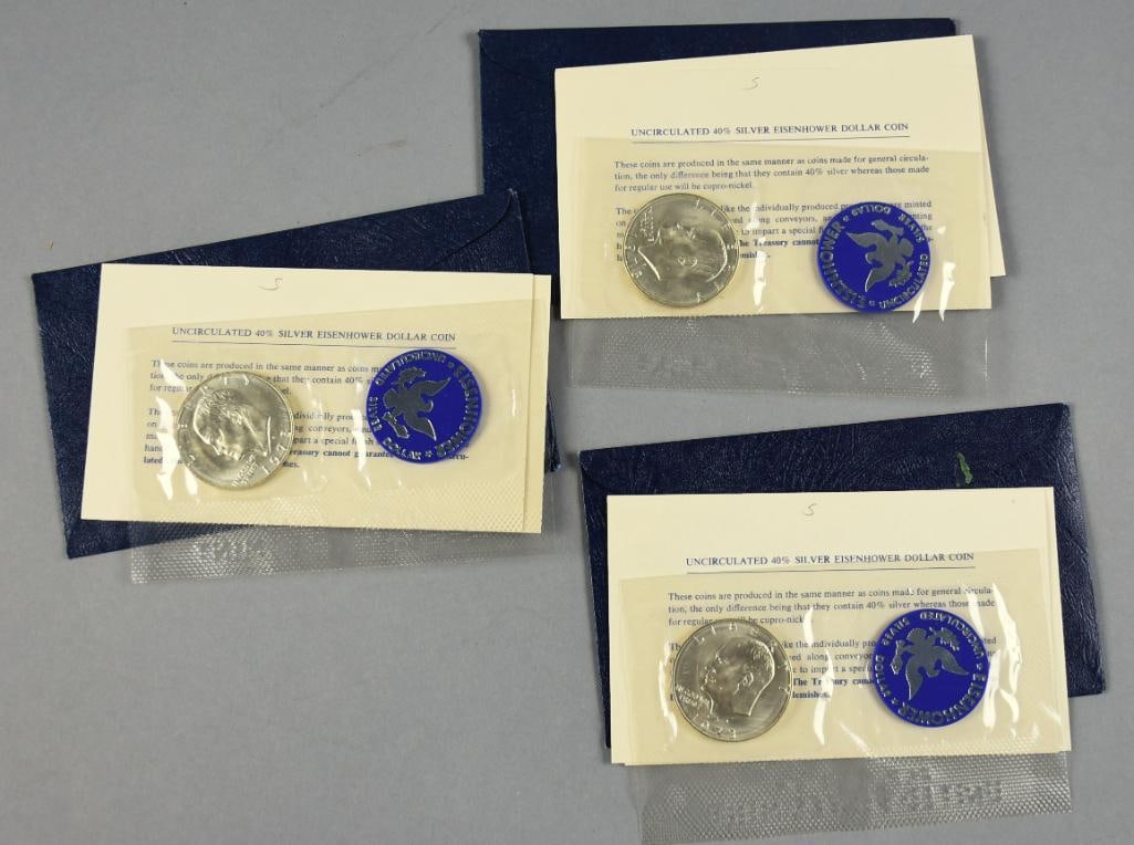 1973 Eisenhower Uncirculated Silver Dollars, 40% Silver: Lot is for three Eisenhower silver dollars from 1973. All are 40% silver and are in the original mint packages.
